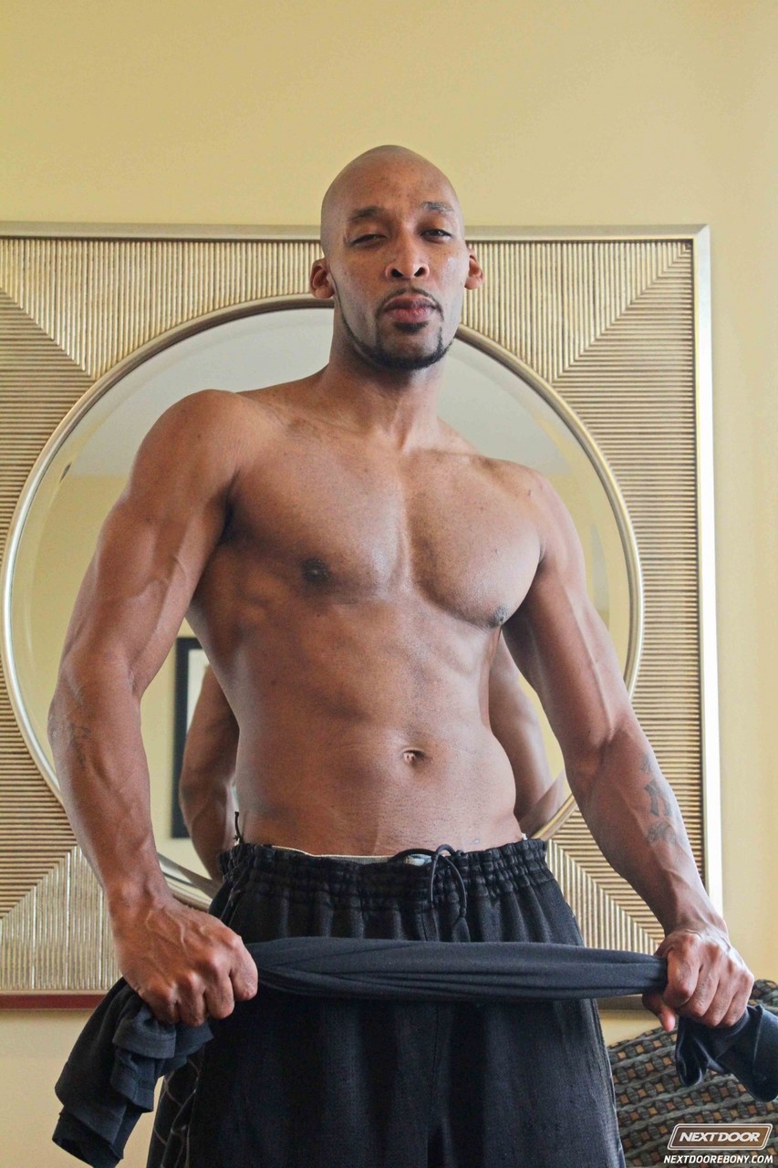 Black bald gay Ramsees exposes his big prick and poses in a hotel room  