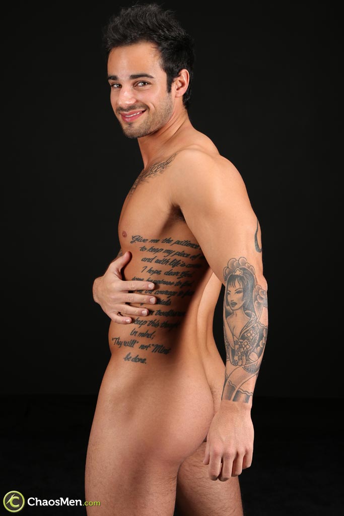Good-looking gay hunk Xavier shows off his tattooed naked body & his hard cock  