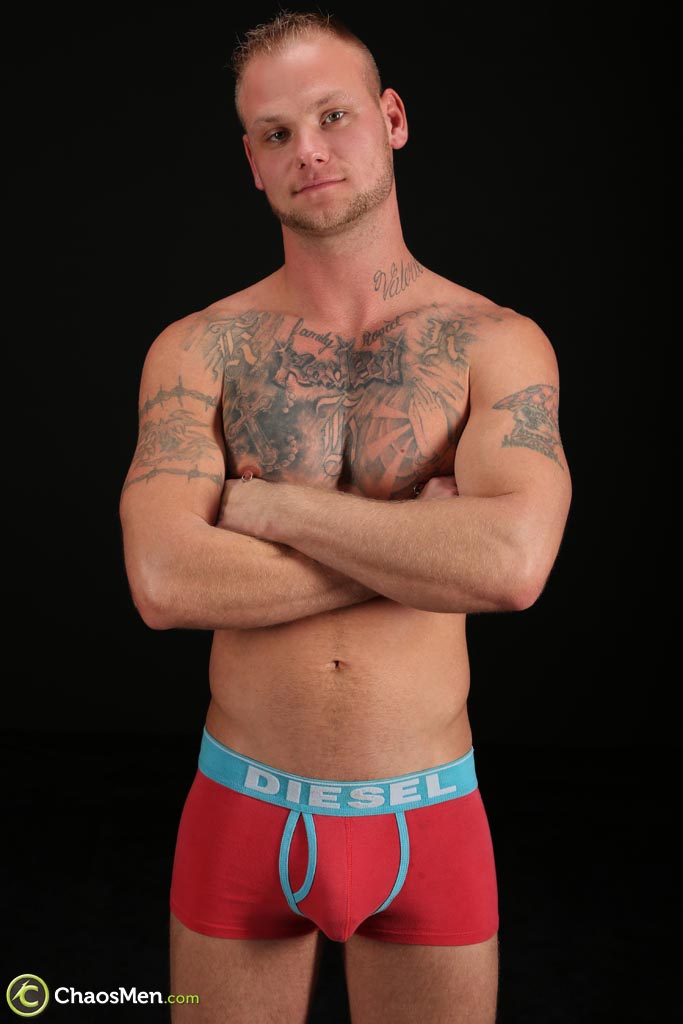 Tattooed gay Corban shows off his athletic naked body & his big dick  