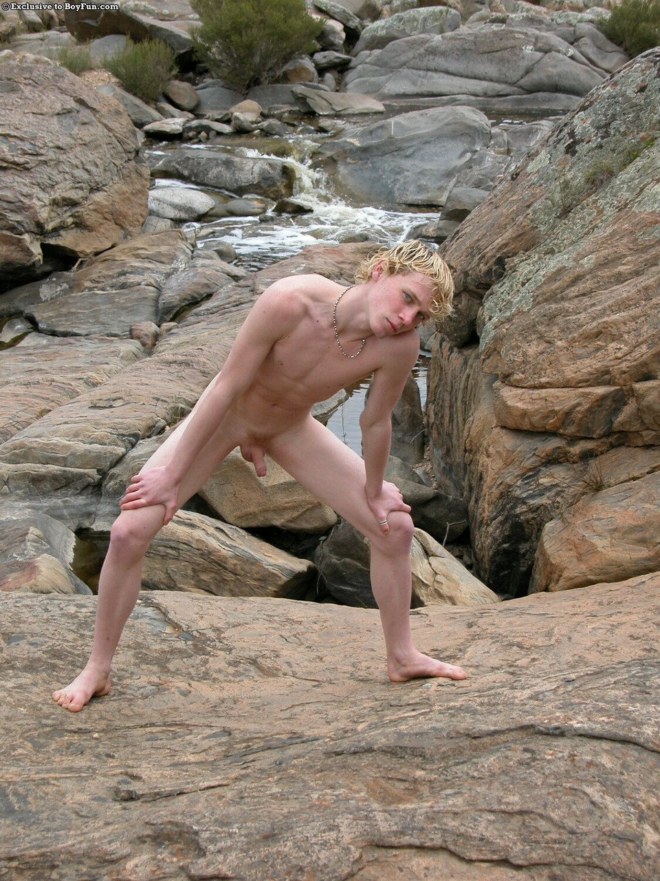 Golden-haired gay hottie Jarrod stripping naked and jerking off by the river  
