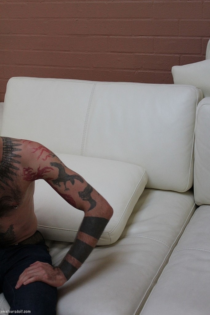 Gay tattooed Rocco Hard gets naked & strokes his pierced dick until he cums  