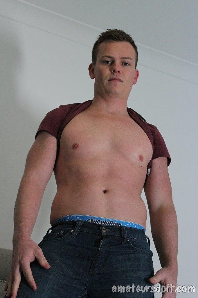 Handsome gay Keegan Keen shows his small uncut cock and jerks off  